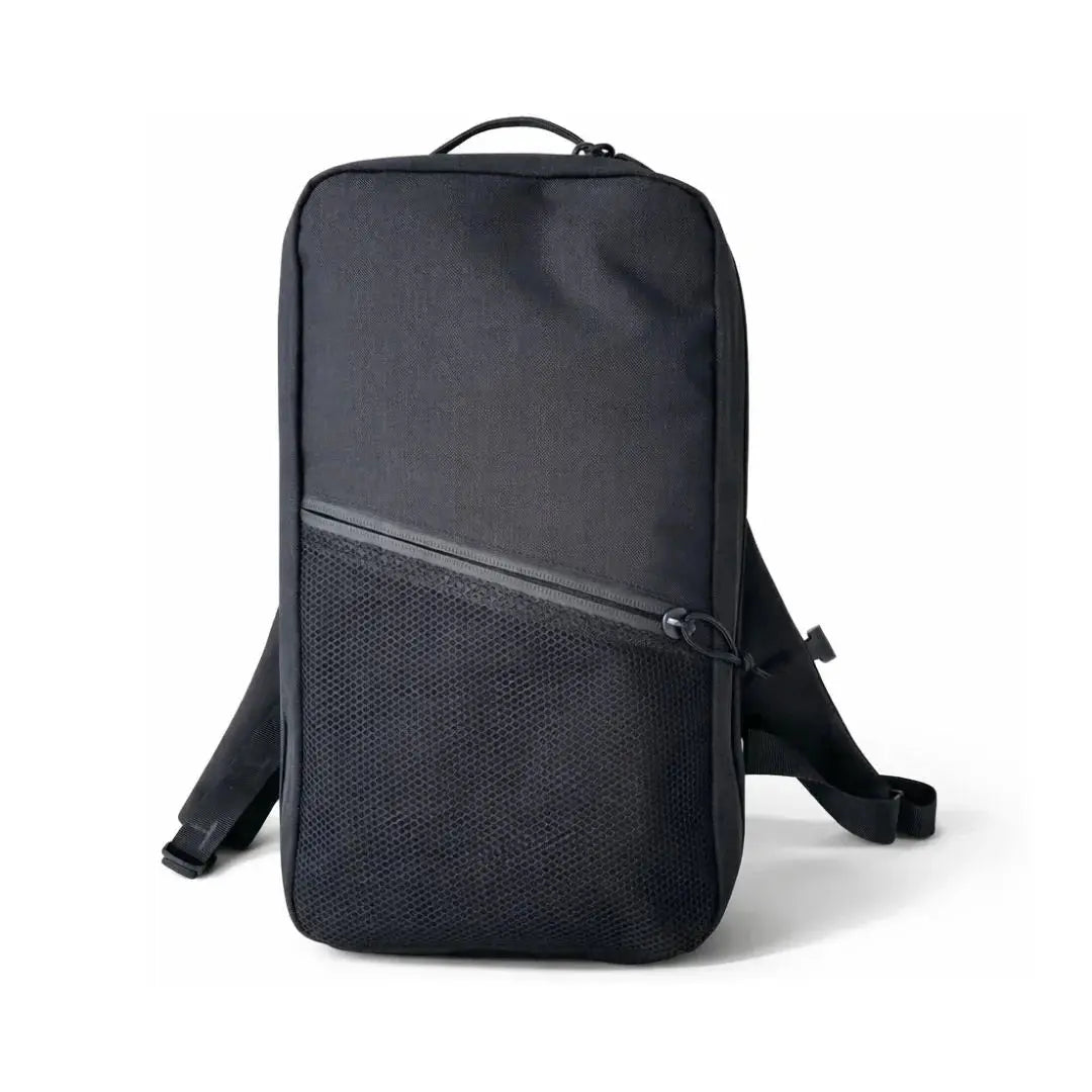 Minimalist black backpack with mesh front pocket and adjustable straps