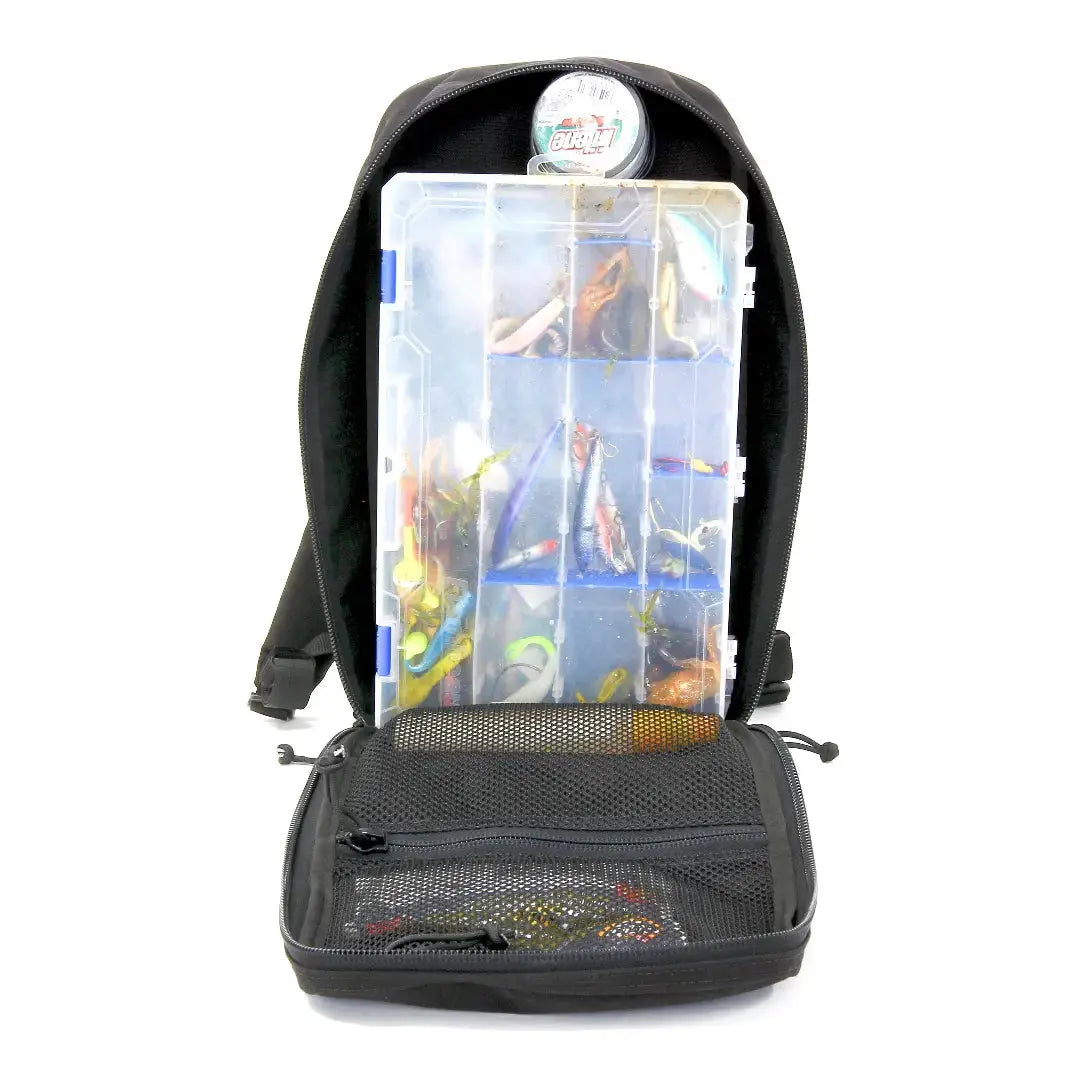 Black backpack with open compartment showing fishing lures and tackle box