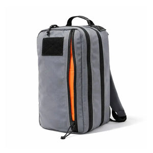 Gray tactical backpack with orange interior and black zippers