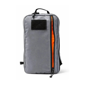 Gray tactical backpack with a bright orange interior and a large front zipper pocket.