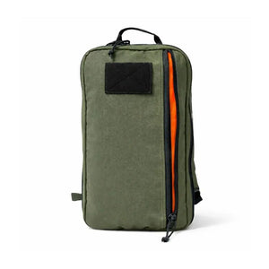 Green backpack with an orange zipper and black patch area