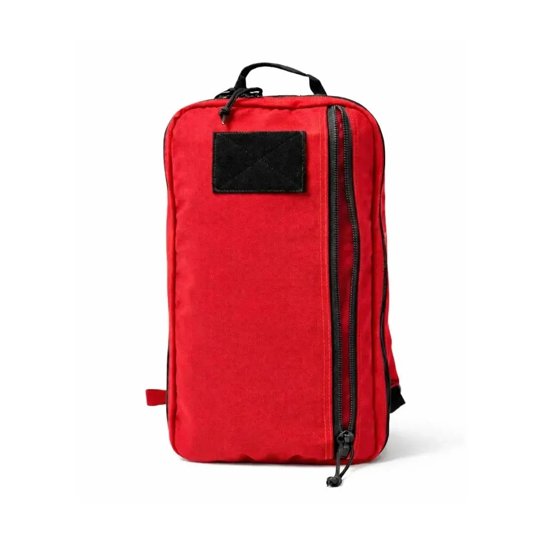 Red 12 Hour Plus Backpack with black patch and black zippers