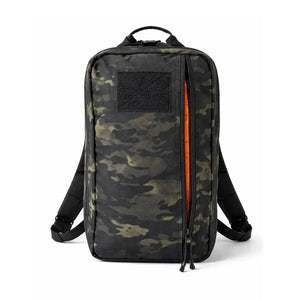 Black and green camouflage backpack with orange zipper detail and a black patch area.