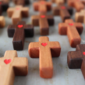 Agape Pocket Crosses with red heart details in various wood tones