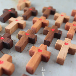Wooden pocket crosses with red hearts