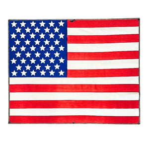 Extra large American flag made from recycled red and white fire hose