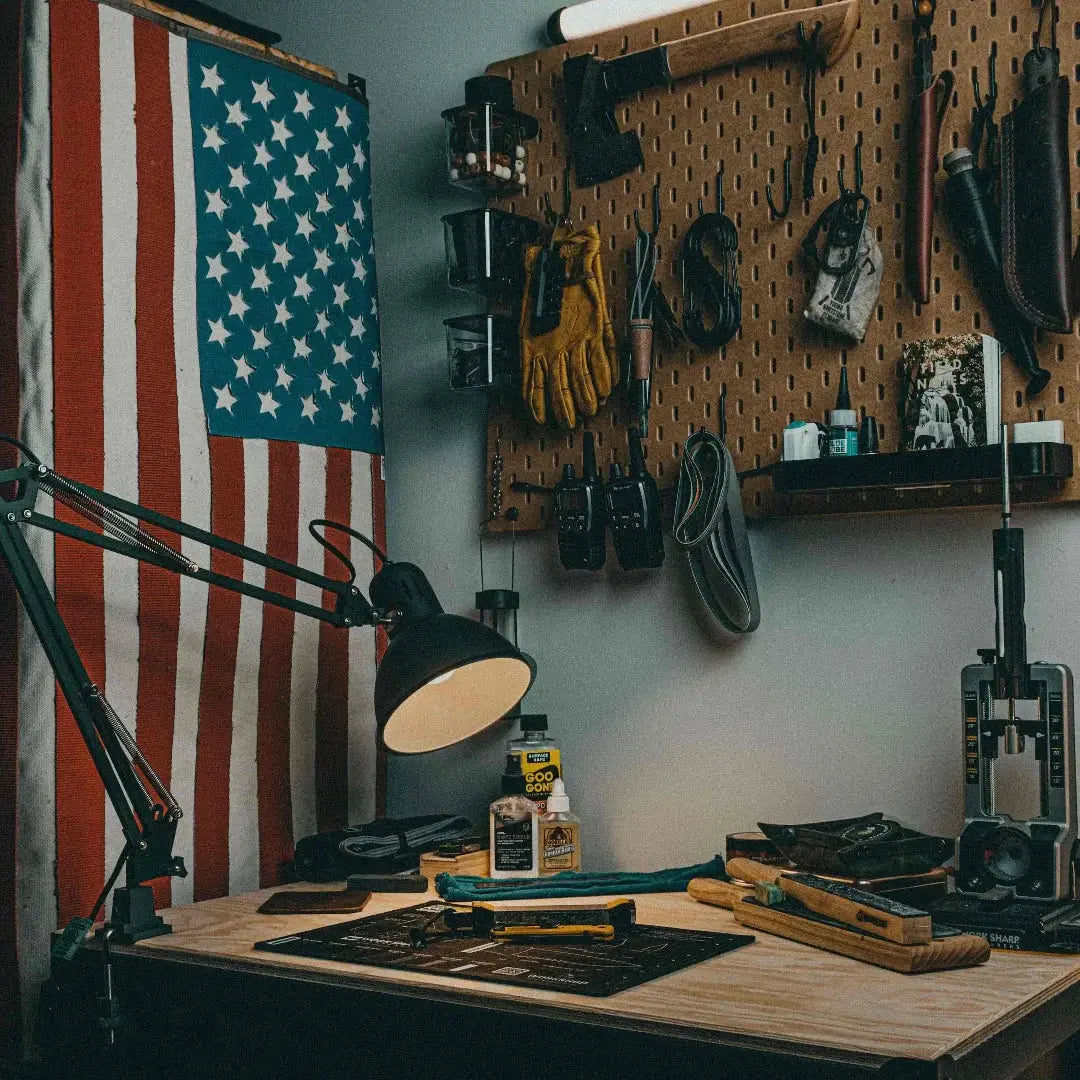 American flag made from recycled fire hose on a desk with tools.