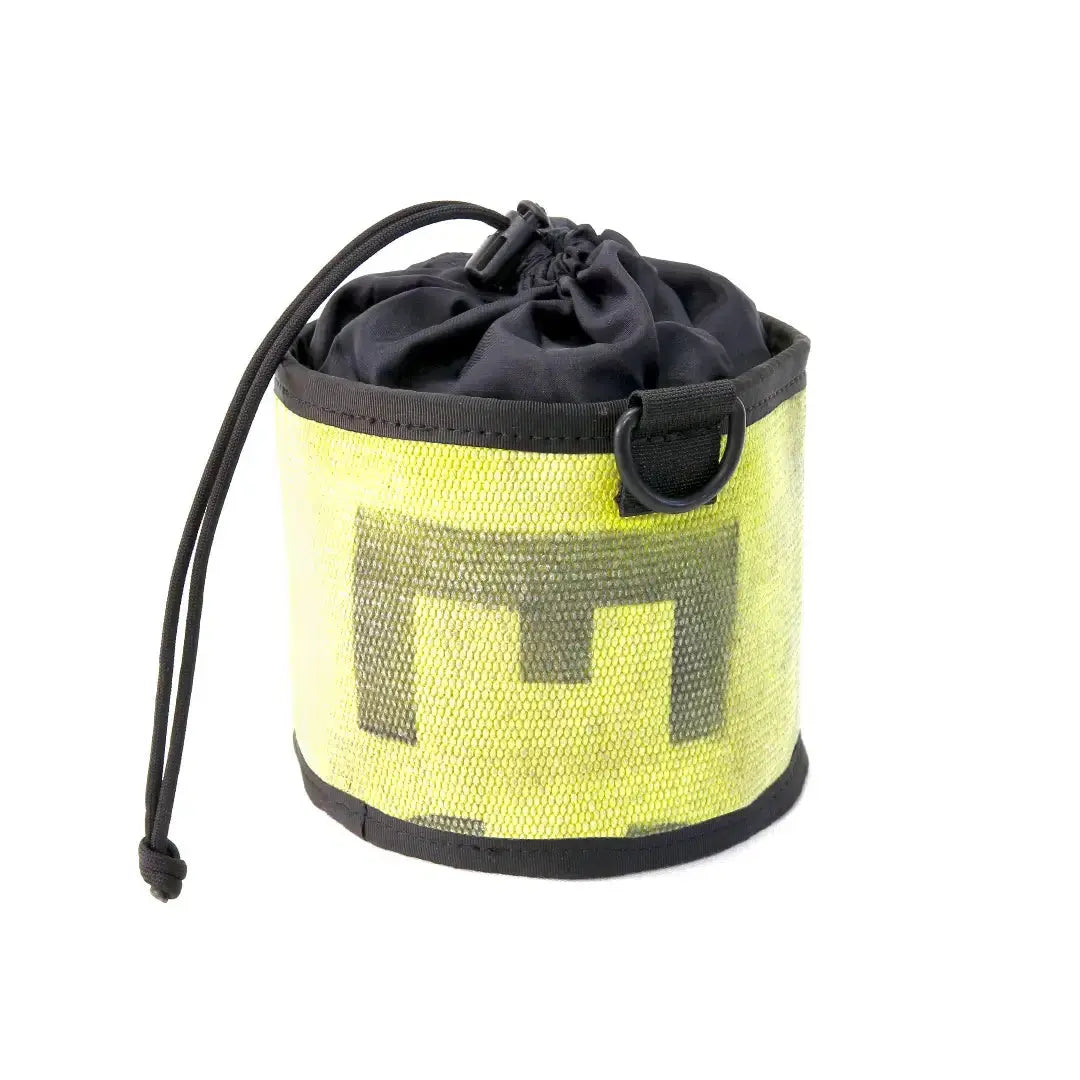Yellow and black ammo bag made from recycled fire hose with "M" logo and drawstring closure.