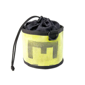 Yellow and black ammo bag made from recycled fire hose with "M" logo and drawstring closure.
