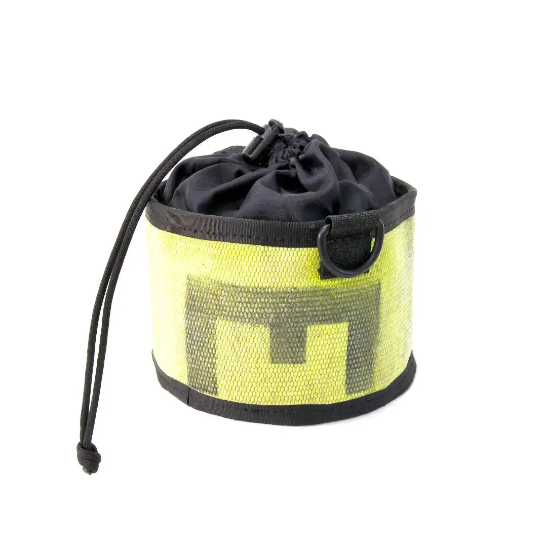 Yellow and black fire hose ammo and gear bag with drawstring closure and metal ring.