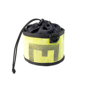 Yellow and black fire hose ammo and gear bag with drawstring closure and metal ring.