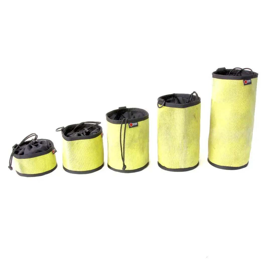 Five yellow recycled fire hose ammo gear bags in different sizes