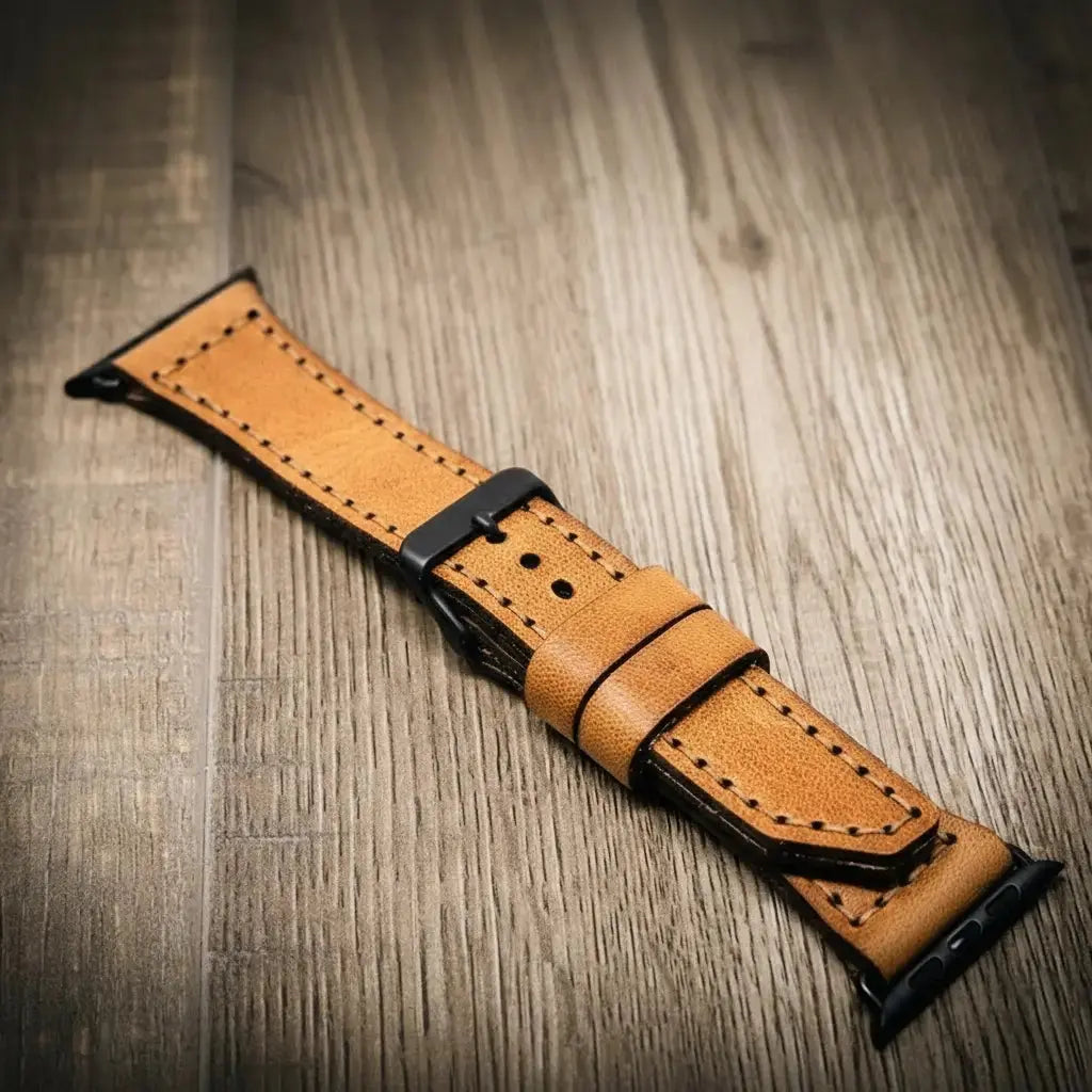 Brown full-grain leather watch band with black hardware.
