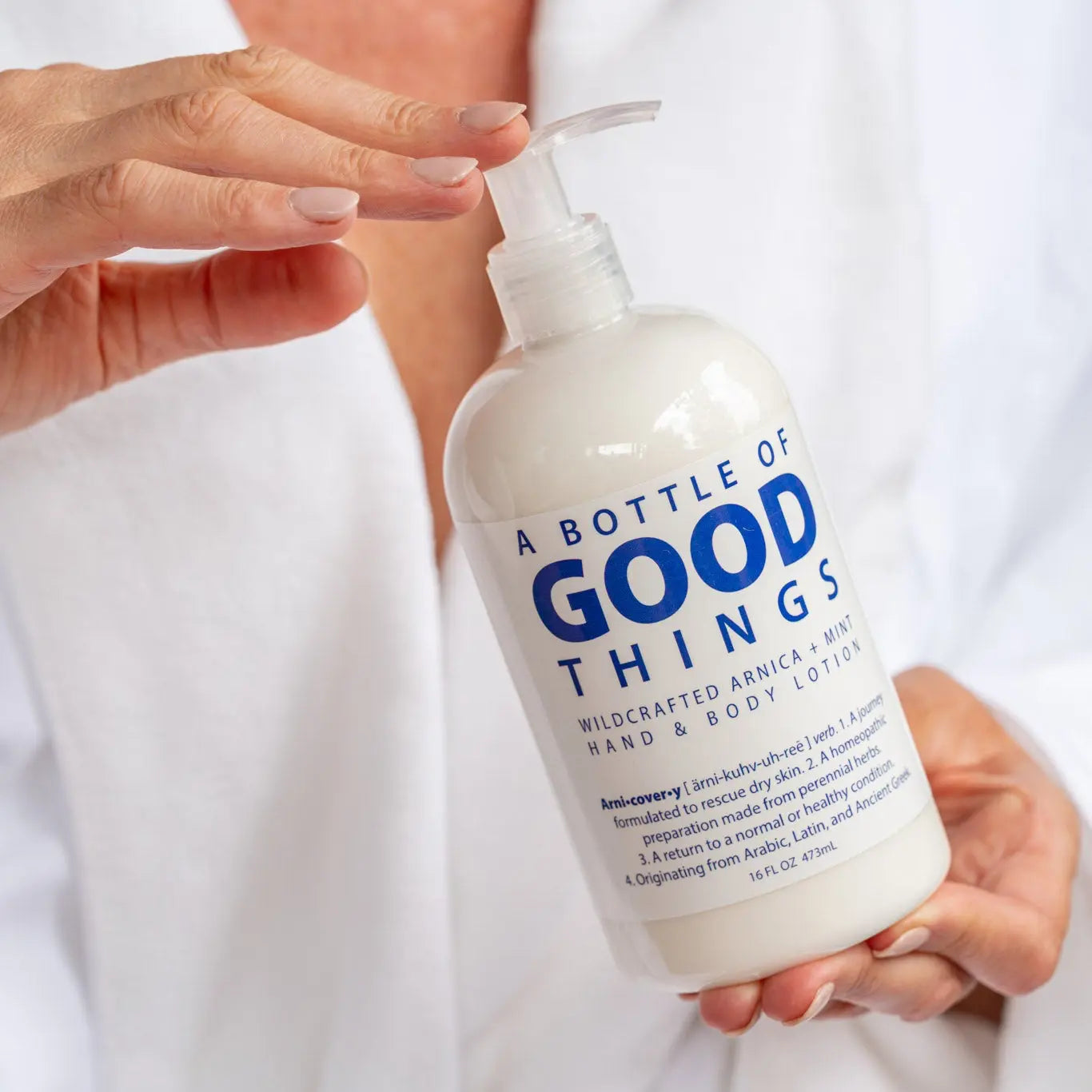 A bottle of "A Bottle of Good Things" Wildcrafted Arnica + Mint Hand & Body Lotion, 16 oz.