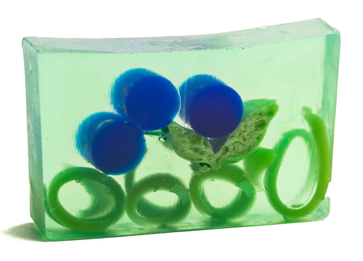 Green translucent soap slice with blue beads and green swirls