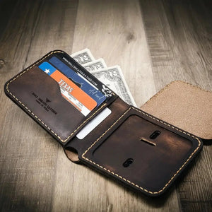 Brown leather bifold wallet with Texas ID, credit cards, and cash