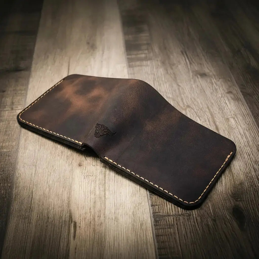 Brown leather bifold wallet with embossed bull logo