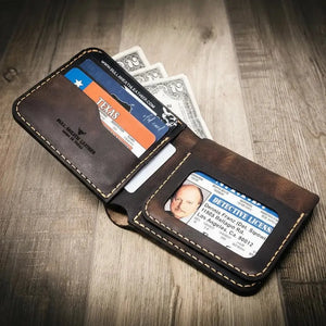 Brown leather bifold wallet with ID window, card slots, and visible cash.