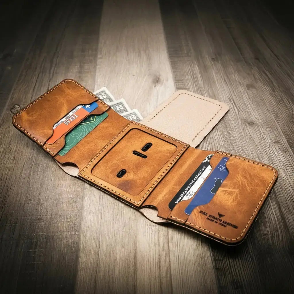 Brown leather trifold wallet with slots for cards, cash, and a badge holder