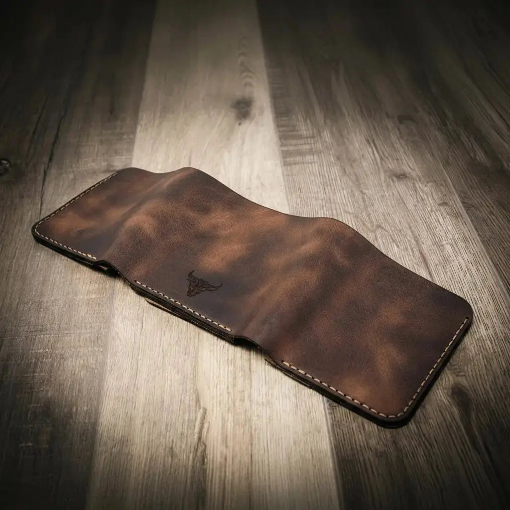 Brown distressed leather trifold wallet with embossed bull logo.