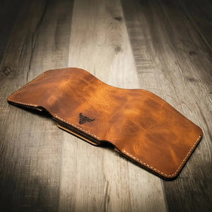 Brown distressed leather trifold wallet with bull logo