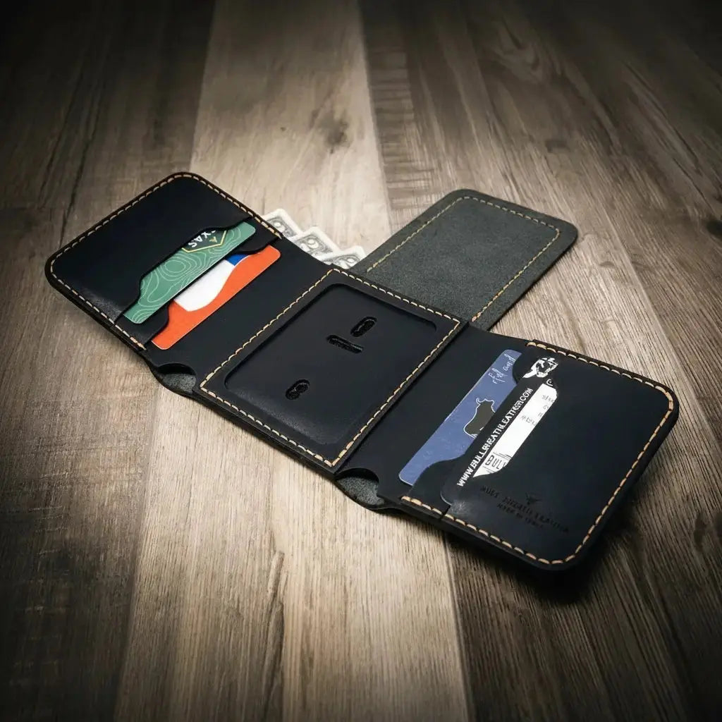 Black leather trifold wallet with card slots and cash pocket, open on a wooden surface.