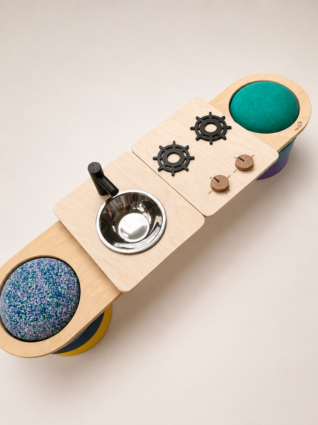 Maple Play wooden cooktop and sink topper on a balance board