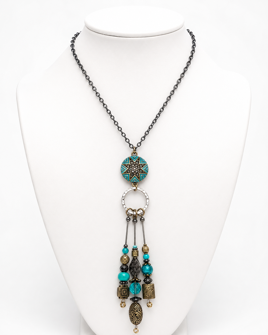 Necklace with decorative elements on a white mannequin