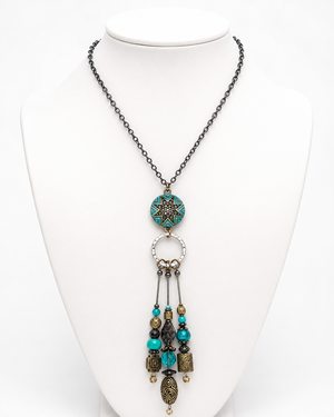 Necklace with decorative elements on a white mannequin