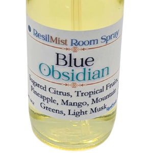 ResilMist Blue Obsidian room spray bottle showing product label with scents: sugared citrus, pineapple, mango, mountain greens, light musk.