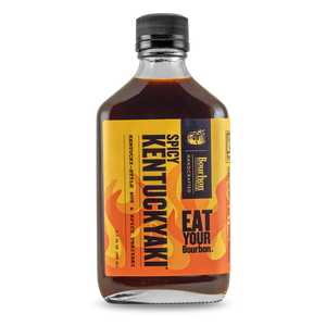 Bourbon Barrel Foods Spicy Kentuckyaki sauce bottle with yellow label and flame graphics.