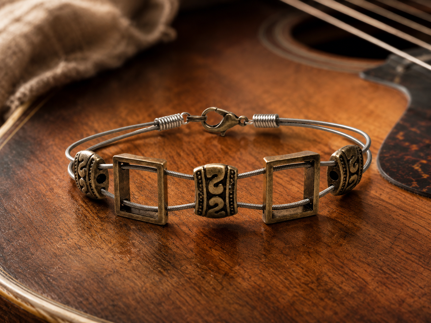 Bracelet with square designs on a wooden surface