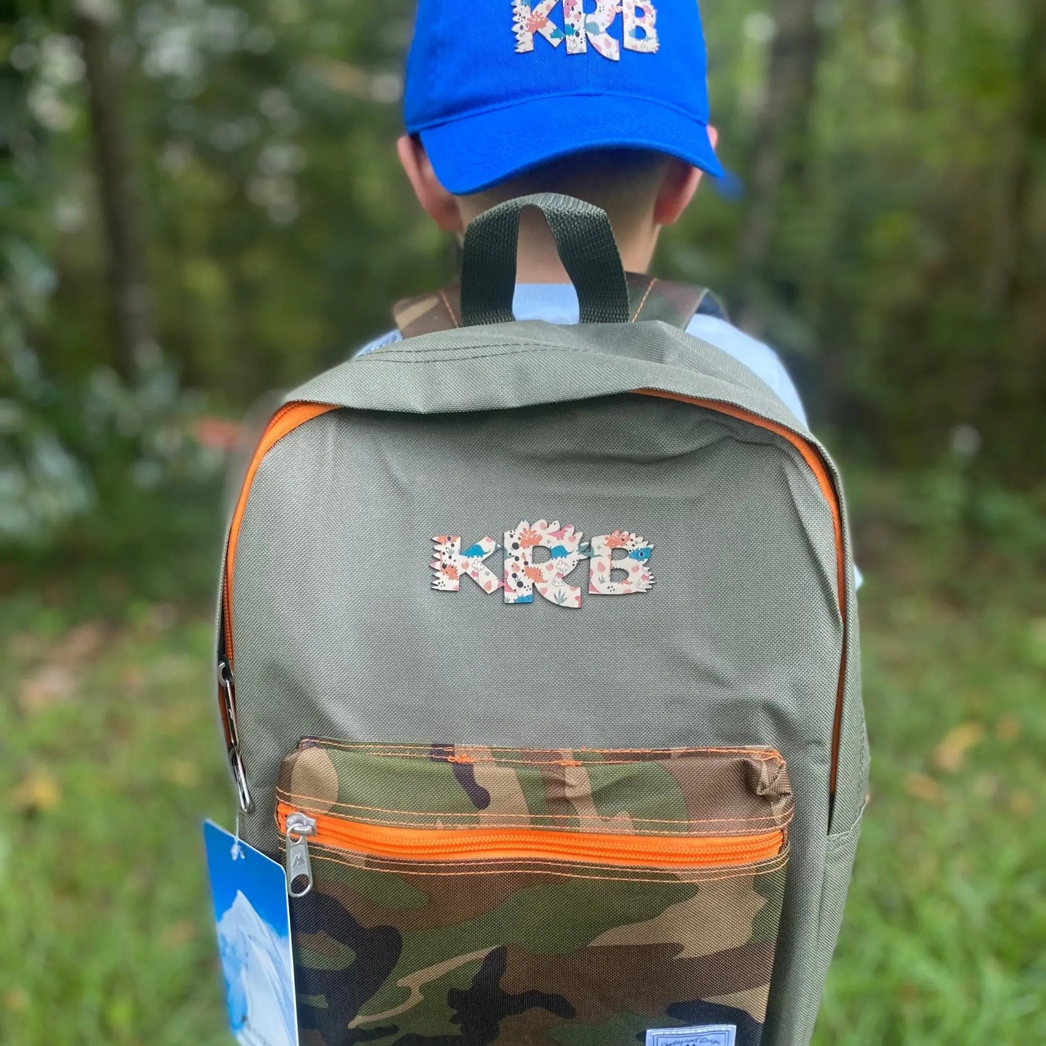 Camo Kids Backpack with Custom Dinosaur Initial Patch by Poor Hog Customs, handmade leather goods main product photo