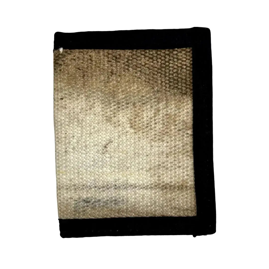 Captain Wallet, made from fire hose, with black trim and textured surface.