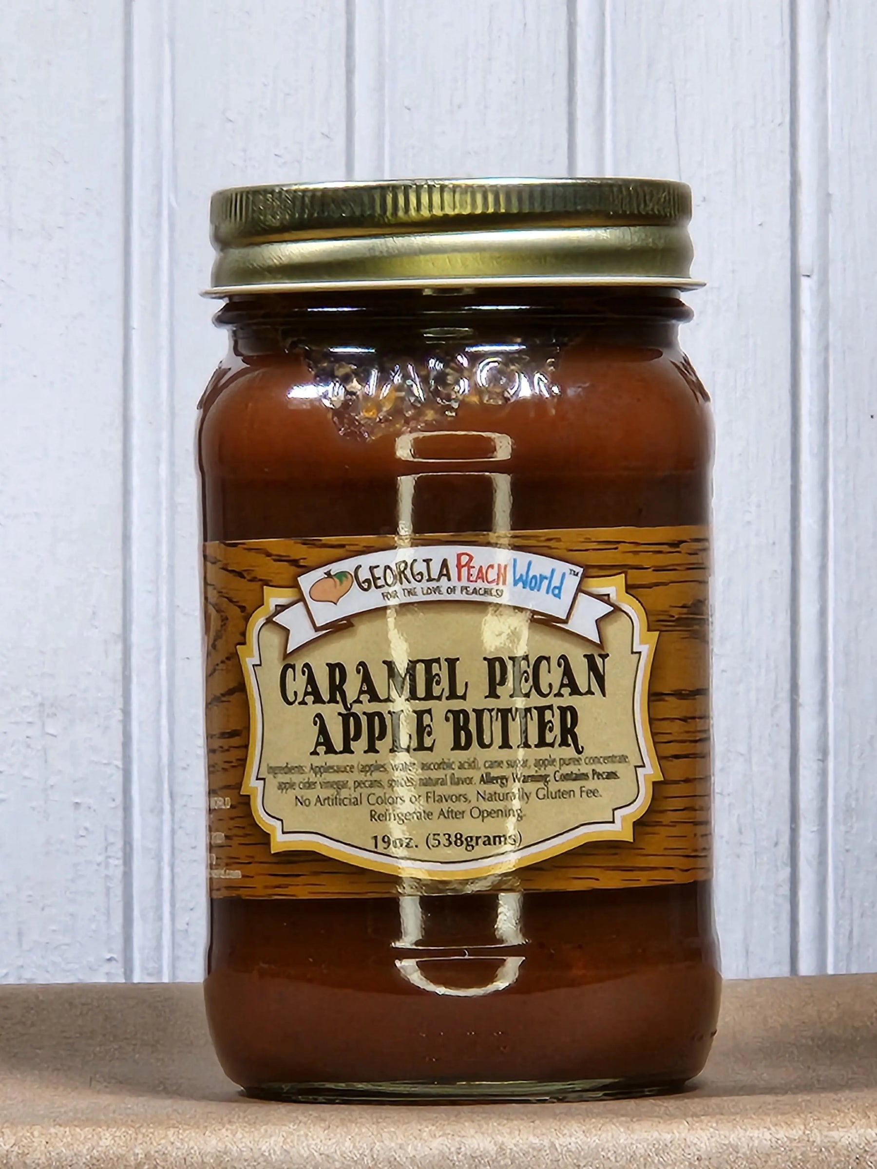 Georgia Peach World Caramel Pecan Apple Butter in a glass jar.