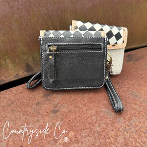 Black leather wallet wristlet with checkered flap and detachable strap.