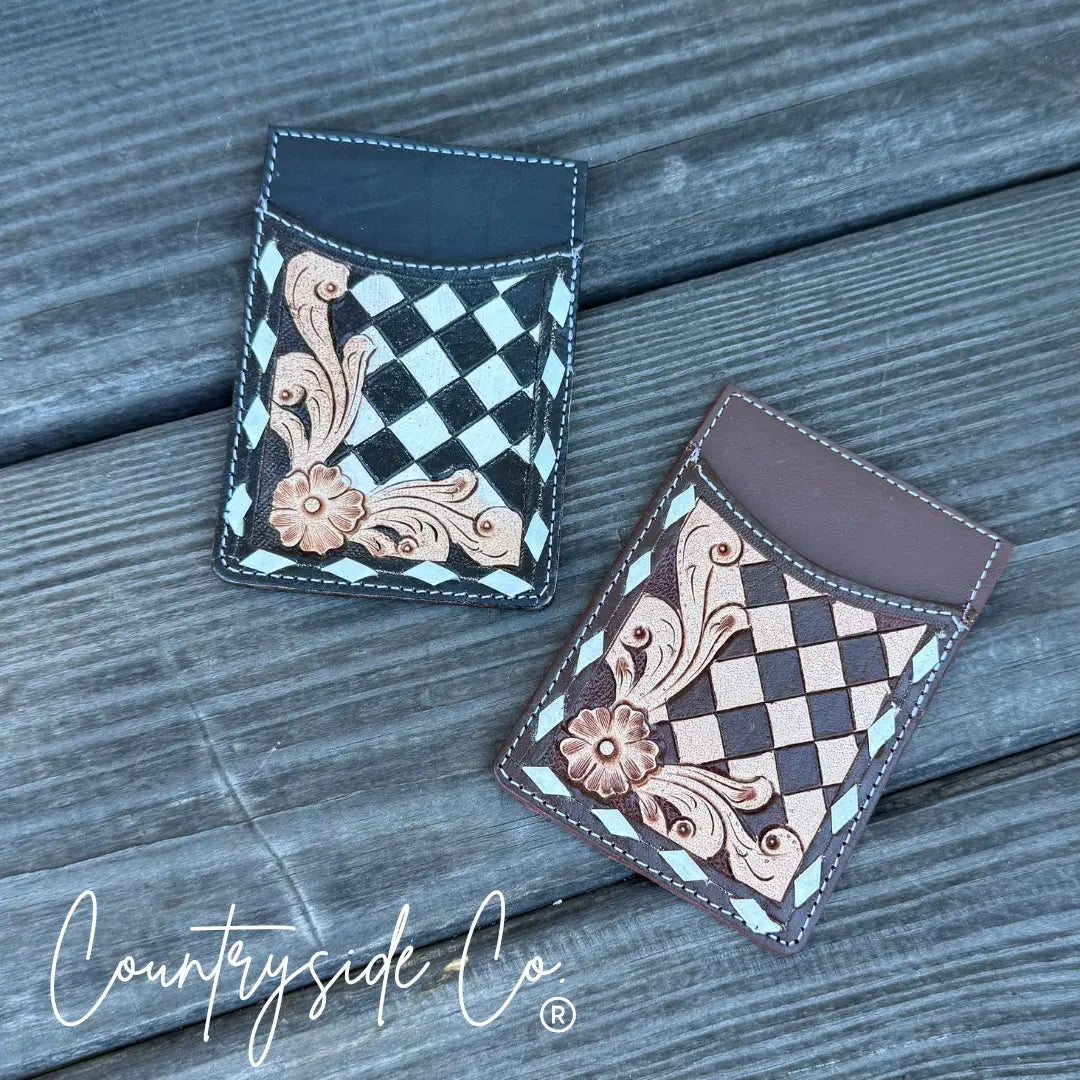 Checkered tooled leather credit card holder in black and brown.
