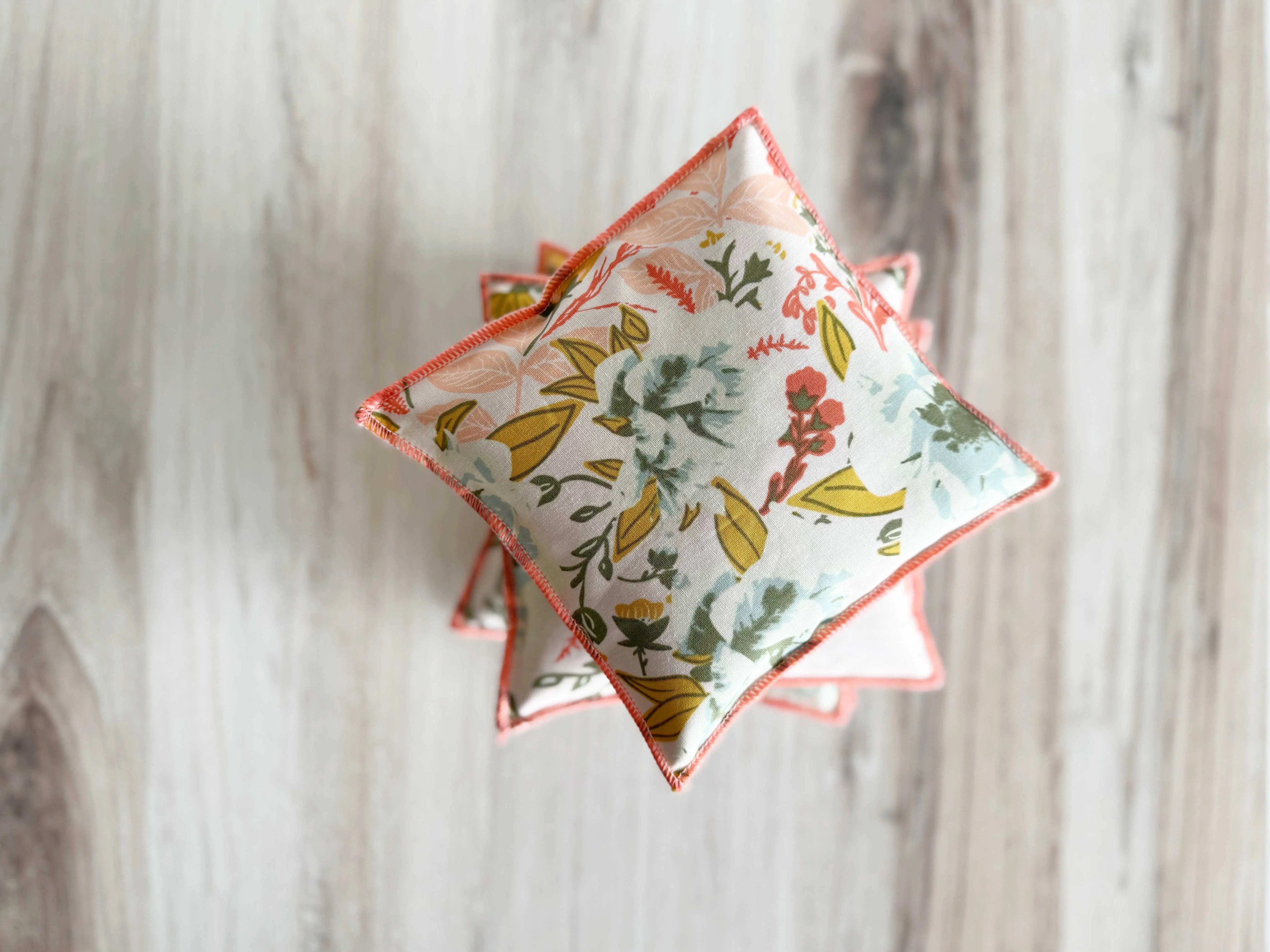 Floral print lavender sachets with coral trim, set of two