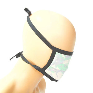 Cotton mask with digital camouflage print and black tie straps.
