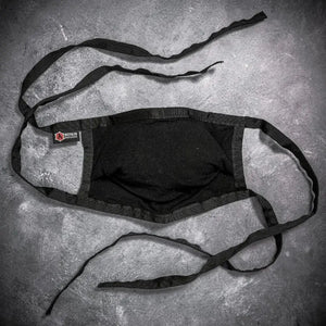 Black cotton face mask with adjustable nose wire and tie straps, featuring a Recycled Firefighter logo.
