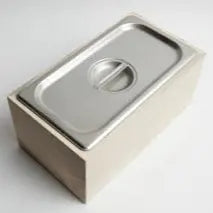 Magnolia wood countertop compost bin with stainless steel interior and lid.