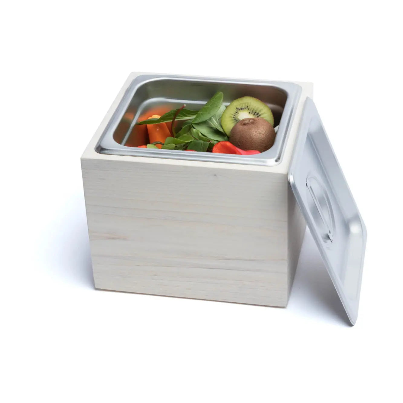 Countertop compost bin: magnolia wood box with stainless steel insert holding fruits and greens, lid to the side.