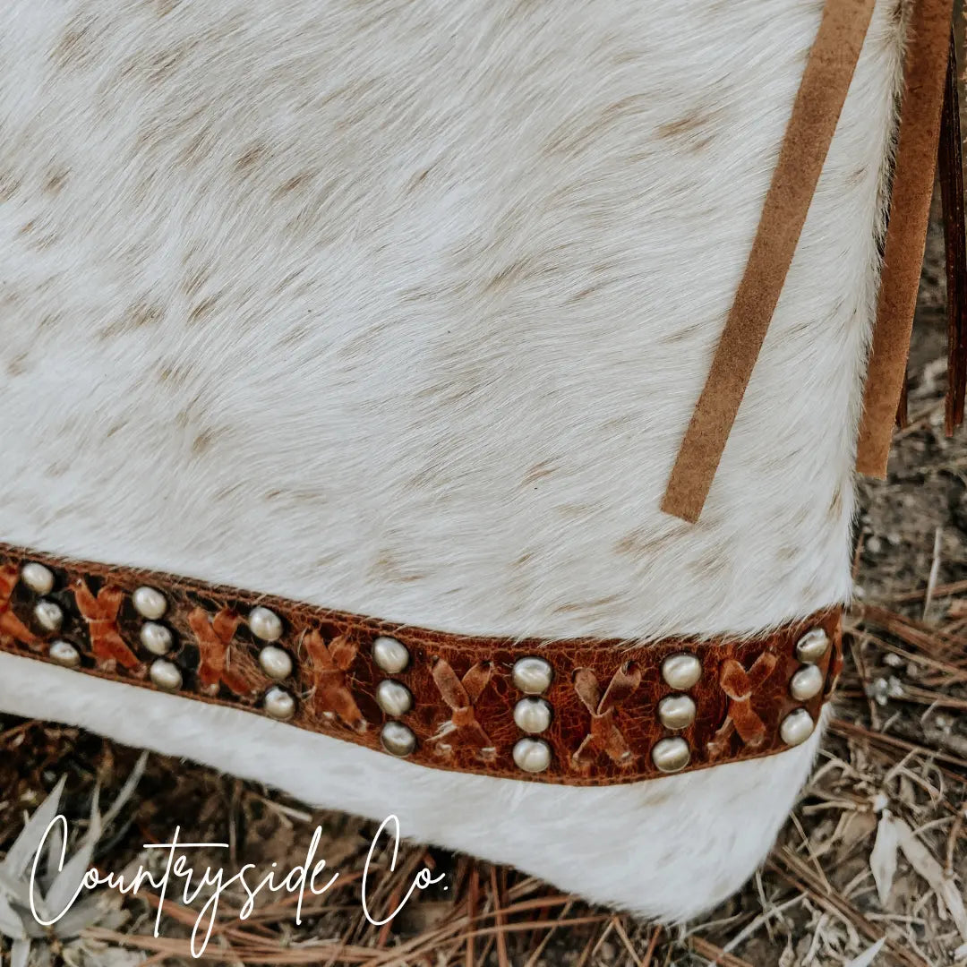 Cowhide leather purse with brass studs and woven leather trim by Countryside Co.