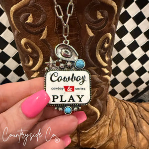 Cowboy Play statement necklace with turquoise accents and western motifs.