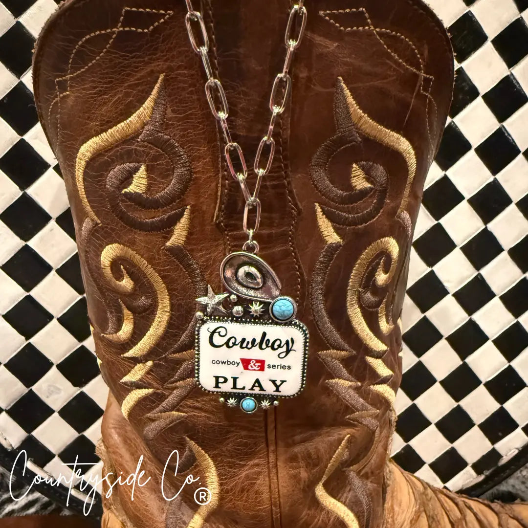 Cowboy Play statement necklace with turquoise accents on cowboy boot.