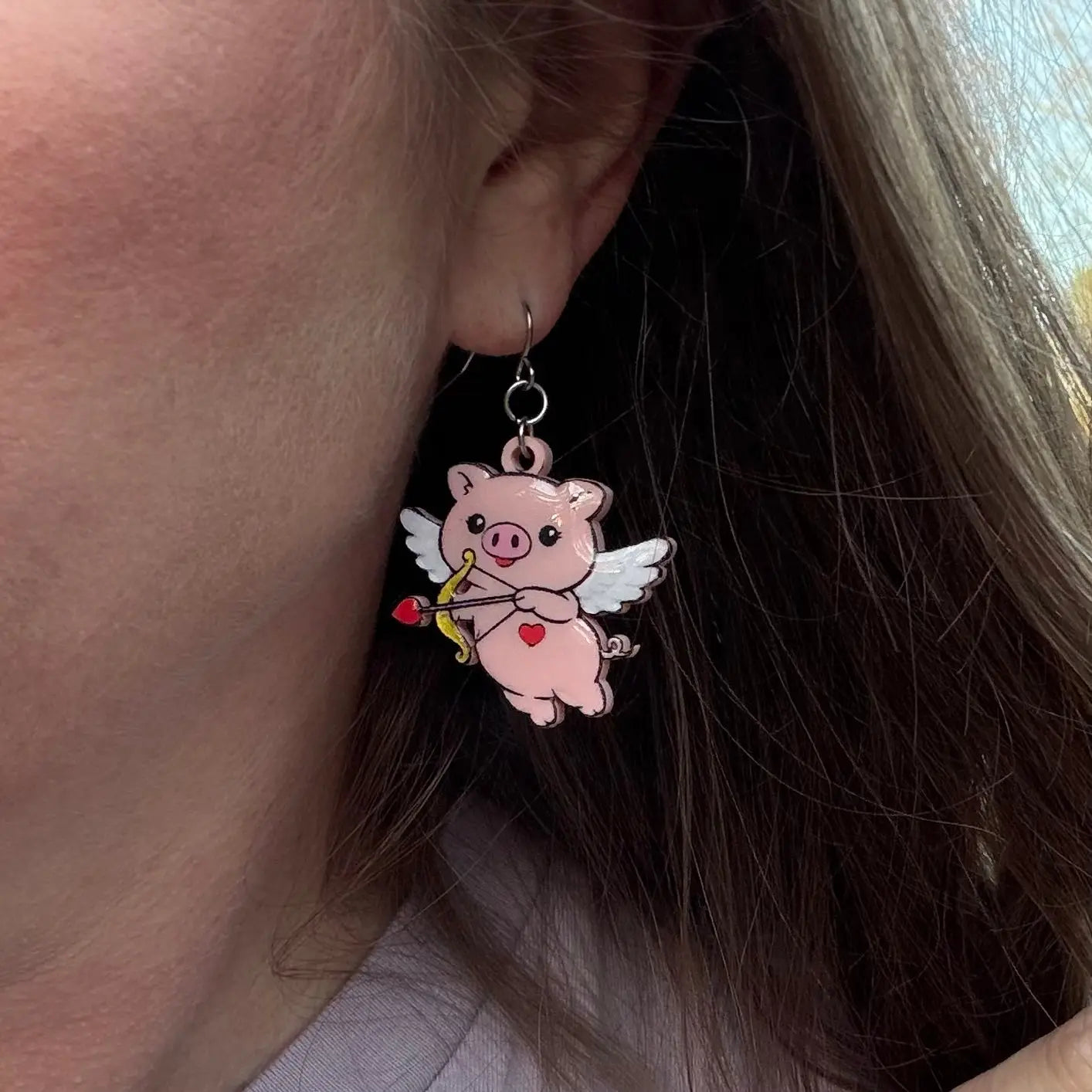 Cupid Pig Earrings: Hand-Painted Acrylic Valentine's Day Jewelry by Poor Hog Customs. Cute Pig Angel Earring. Wearing Pig Earring on Ear