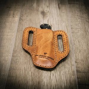 Custom leather knife sheath with 'Bull Sheath Leather' and 'Made in Texas' embossed.
