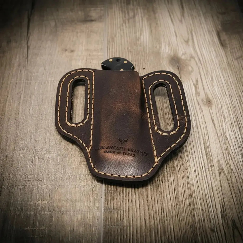 Custom brown leather knife sheath with double stitching and belt loops, made in Texas.