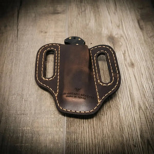 Custom brown leather knife sheath with double stitching and belt loops, made in Texas.