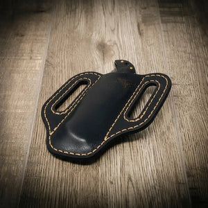 Black leather knife sheath with bull emblem and tan stitching